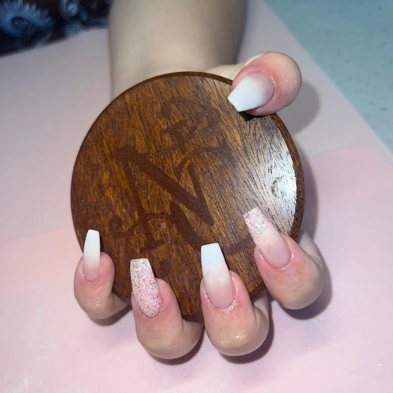 Nail extensions with NC Wellbeing branded coaster